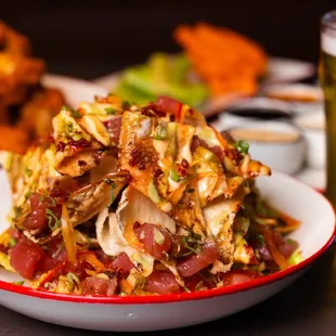 a plate of food and a glass of beer