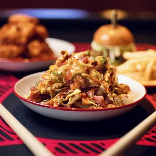 a plate of food and chopsticks