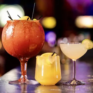 two cocktails on a bar