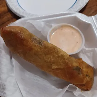 Soulfood egg roll with dip.