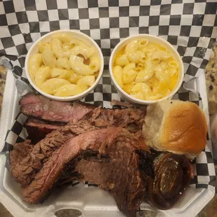 Sliced brisket, ribs with mac and cheese