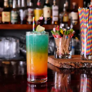 a colorful cocktail on a bar