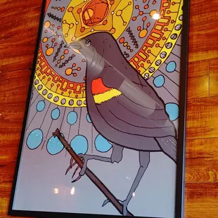 a picture of a bird on a stick