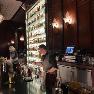 a man and a woman behind the bar