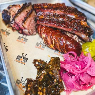 The Meat Sweats Platter -- ribs, **Beef Brisket, Sliced, **Jalapeno-Cheddar Sausage, Housemade