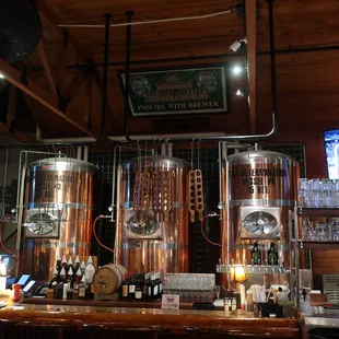a bar with copper tanks