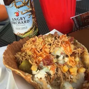 a plate of food and a bottle of beer