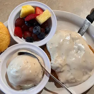 Fantastic Wednesday special on 12/14/22: country fried steak &amp; masked potatoes with white gravy, and fresh fruit and muffin.