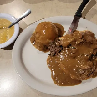 Open faced roast beef with a side of applesauce