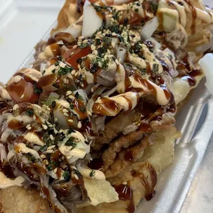 Kanak *A*Tack Wonton Nacho Chips 
(Kalua pig, spicy ahi poke, and lomi salmon)