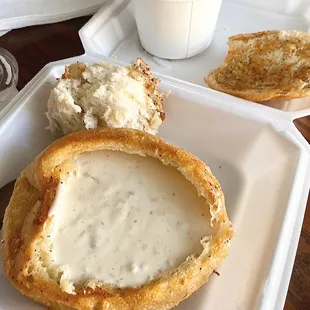 a bowl of soup and bread