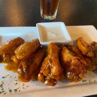 Thai chili wings with a side of ranch and a sweet tea