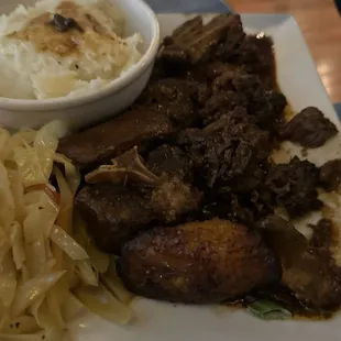 Oxtails with mashed potatoes and cabbage