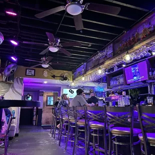 a bar with purple lighting