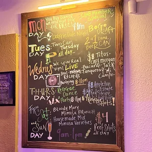 a blackboard with a list of events