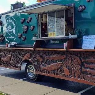 a food truck parked on the side of the road