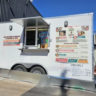 a food truck parked in front of a building