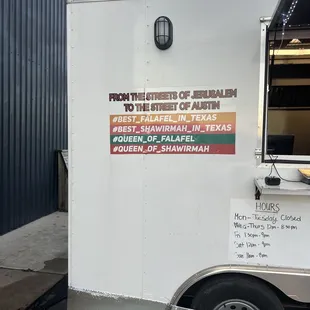 a food truck parked in front of a building