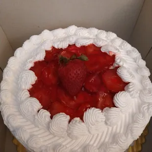 a strawberry cake in a box