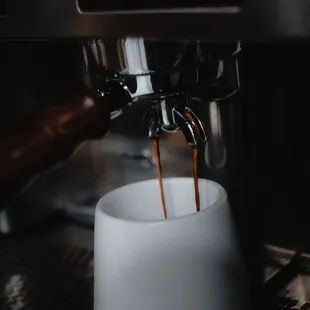 coffee being poured into a cup