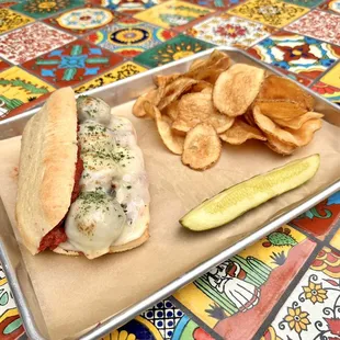 House-made Meatball Sub with Fresh Made Chips. Featuring Polk&apos;s Folly Farm&apos;s Red Chile Pork!
