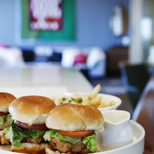 a plate of burgers and french fries