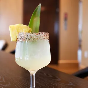 a margarita with a pineapple garnish