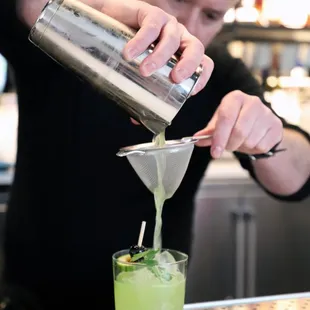 a bartender making a drink