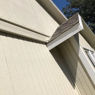 Rotten wood left and painted over