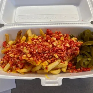 French fries with queso and hot cheetos