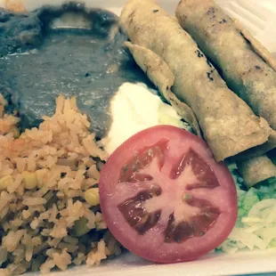 Flautas, rice, frijoles.