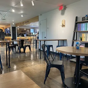 Inside Refuge - plenty of tables and book-style board games available