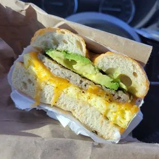 Jalapeno cheddar bagel with cheese, egg, sausage and avocado.