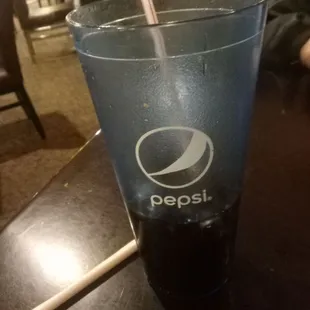 Dr. Pepper in a Pepsi glass.