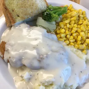 Monday&apos;s Special Chicken Fried Steak w/ country gravy, mashed taters, corn + a piece of broccoli &amp; cauliflower and Texas toast.