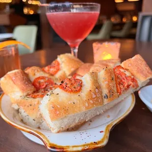 Complimentary house made focaccia bread along with an olive oil-cannellini bean dip!