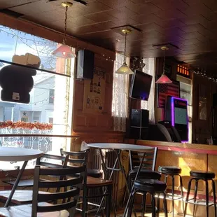 a restaurant with tables and chairs