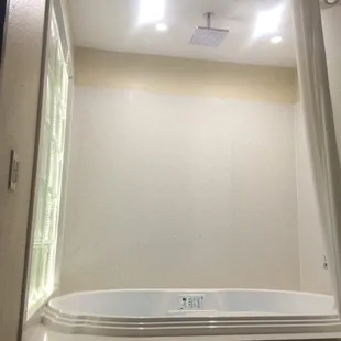 With a waterfall shower head too