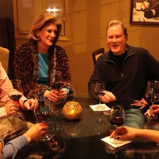 a group of people sitting around a table