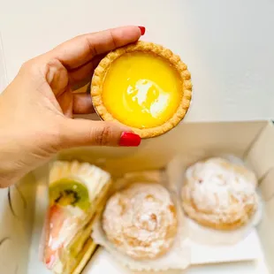 Egg tart, cream puffs and fruit cake. Soft and creamy little tart!