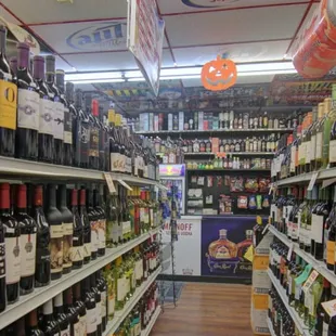 rows of bottles of wine on shelves