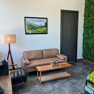 a living room with a couch, coffee table, and television