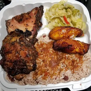 chicken, rice, and coleslaw in a styrofoam container