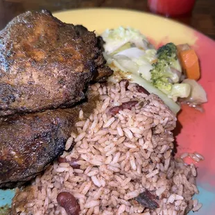 Jerk chicken , rice and peas, cabbage