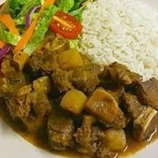 a plate of food with rice and vegetables