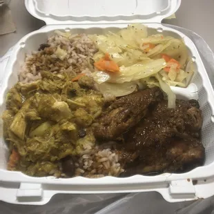 Curry chicken, jerk wings, rice &amp; peas, and cabbage.