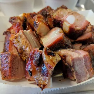 a plate of ribs and coleslaw