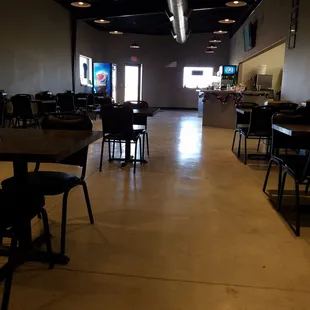 a restaurant with tables and chairs