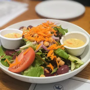 House Salad! We asked to split it and they served it in a beautiful big bowl with two dressing cups.