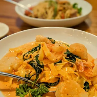 Shrimp and Scallops with a cream tomato basil sauce on top of egg noodles!